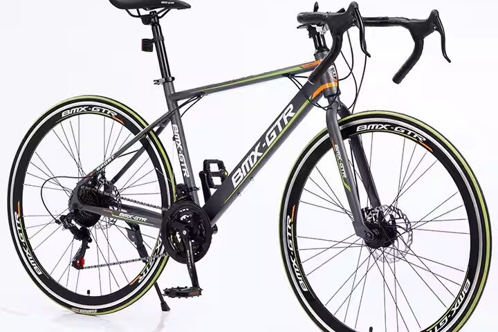 Modern adult road bike with fashionable frame and disc brakes from factory