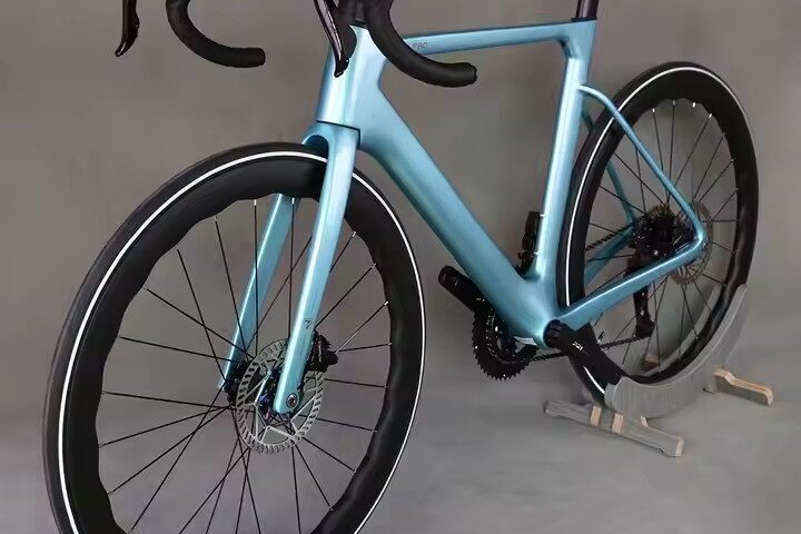 Full carbon fiber road bike with aerodynamic frame and disc brakes