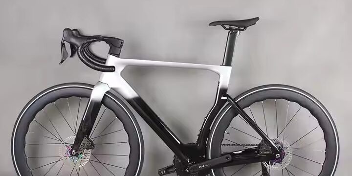 Full carbon fiber road bike with aerodynamic frame and disc brakes